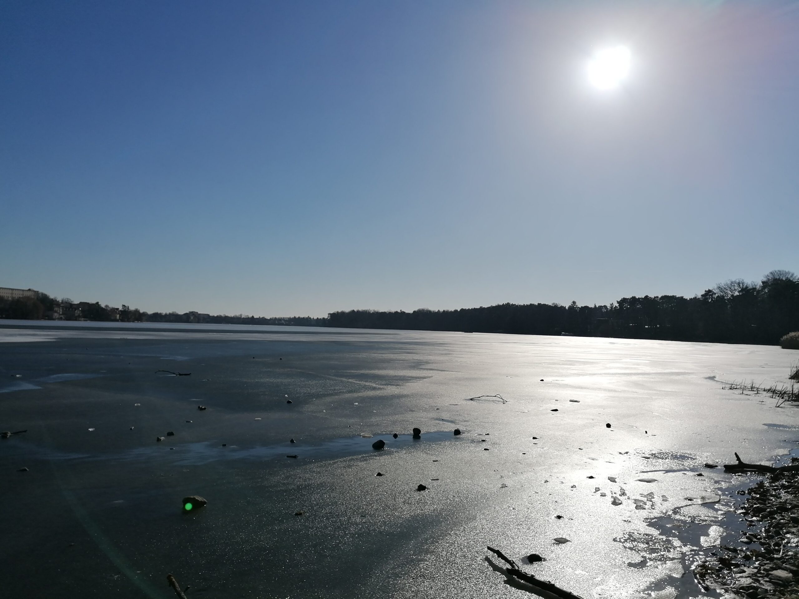 Frozen winter lake symbolizing rest, reflection, and finding calm during dark seasons.